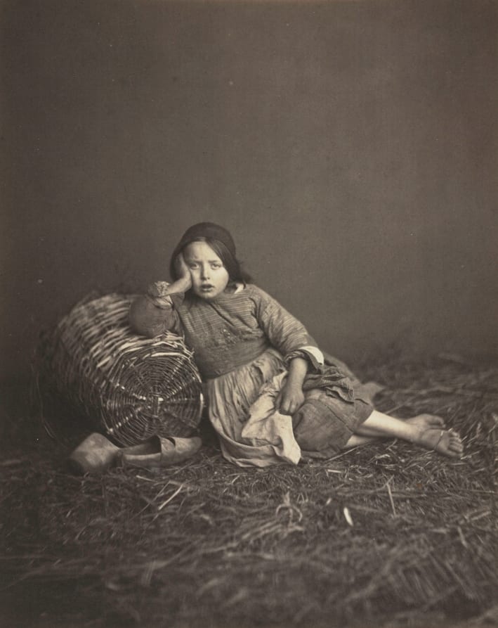 Young Girl Seated on Straw, Leaning on a Basket — artwork